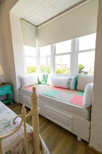 A bed or beds in a room at Kupina Alaçatı