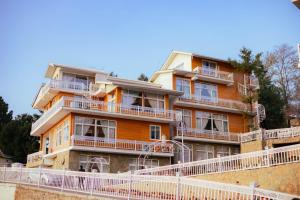 a building with balconies on the side of it at Himalaya Villas 2 bedroom suite in Murree