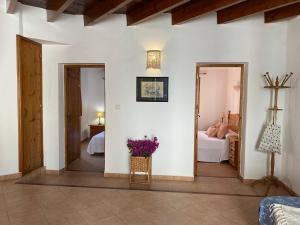 Postel nebo postele na pokoji v ubytování Casa Barca Cala Saona