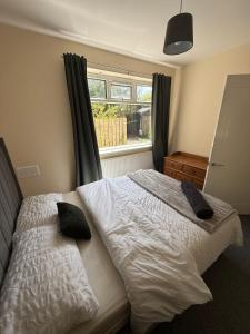 a bedroom with a bed with two pillows on it at ResiLets - Modern Central Town Centre Apartment - Sleeps 4! in Blythe