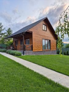 a rendering of a house with a pathway at Casuta Sofiei in Vîrfu Dealului +20 photos