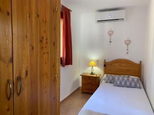 Postel nebo postele na pokoji v ubytování Casa Barca Cala Saona
