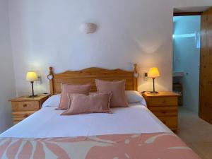Postel nebo postele na pokoji v ubytování Casa Barca Cala Saona
