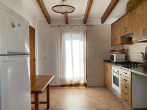 Kuchyň nebo kuchyňský kout v ubytování Casa Barca Cala Saona