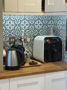 a kitchen counter with a toaster and a toaster at Victorian Rooms by Beach in Ramsgate