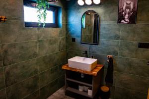 a bathroom with a sink and a mirror at Monialuki in Nogat +70 photos