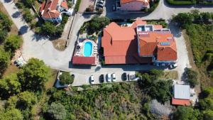 an overhead view of a house with an orange roof at Pansion Comfort Sidro in Novalja