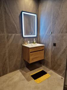 a bathroom with a sink and a mirror at Bella Vista MEHDIA in Kenitra