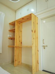 a closet with a door in a room at Mama Killa Studio,1BHK,Apartment in Pushkar