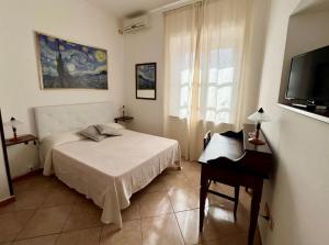 Postel nebo postele na pokoji v ubytování B&B Hibiscus