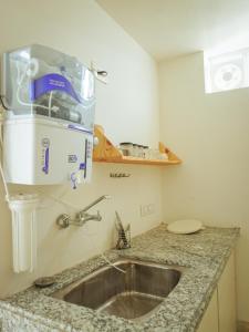 a kitchen with a sink and a mixer on a counter at Mama Killa Studio,1BHK,Apartment in Pushkar