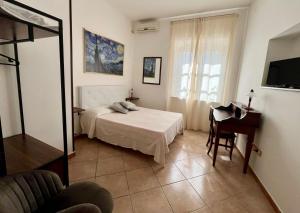 Postel nebo postele na pokoji v ubytování B&B Hibiscus