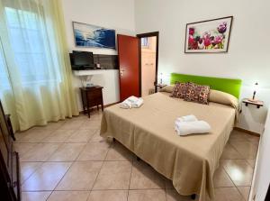 Postel nebo postele na pokoji v ubytování B&B Hibiscus