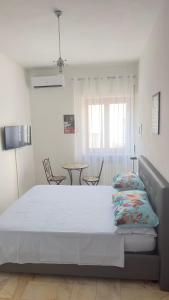 Letto o letti in una camera di Affittacamere Casa Flora