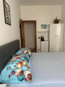 Letto o letti in una camera di Affittacamere Casa Flora