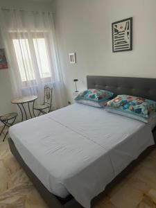 Letto o letti in una camera di Affittacamere Casa Flora