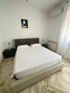 Letto o letti in una camera di Affittacamere Casa Flora