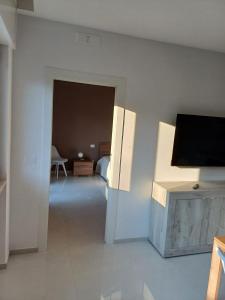 a room with a flat screen tv on a wall at Dany's Home Venus in Giovinazzo
