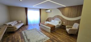 Postel nebo postele na pokoji v ubytování Hotel Pojata