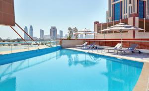 The swimming pool at or close to Staybridge Suites - Doha Lusail by IHG