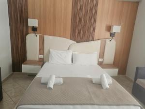 Postel nebo postele na pokoji v ubytování Hotel Pini