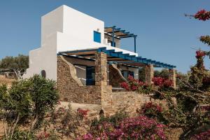 a house on the hill with flowers at Aurea Blu studio 17, Sea view, tranquility, relaxation, sun in Aliko Beach
