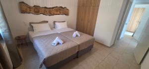Posteľ alebo postele v izbe v ubytovaní Mykonian Tramonti Villas