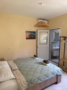 Кровать или кровати в номере Villa Alexandros