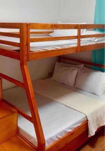 a couple of bunk beds in a room at Sea-Sky Blue Beach Resort at Malabrigo Lobo Batangas-BG in Lobo