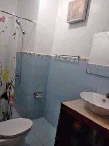 a bathroom with a sink and a toilet and a shower at Sea-Sky Blue Beach Resort at Malabrigo Lobo Batangas-BG in Lobo