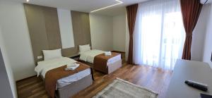 Postel nebo postele na pokoji v ubytování Hotel Pojata