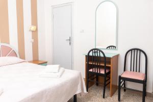 Voodi või voodid majutusasutuse Hotel Gin sul mare toas