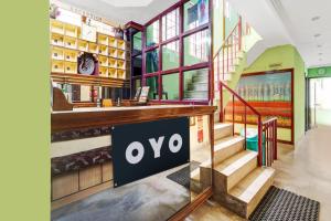 a store with a ovation sign on the wall at Hotel O Rainbow Stays in Tiruchchirāppalli
