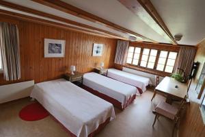 Postel nebo postele na pokoji v ubytování Hotel am Schönenbühl