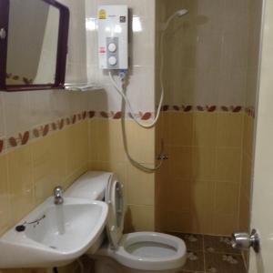 a bathroom with a toilet and a sink at Smart Residence@Muengthongthani in Nonthaburi