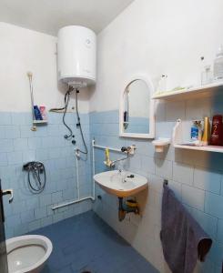 a bathroom with a sink and a toilet at Vikendica Nina in Bor +14 photos