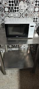 a microwave sitting on top of a table at Astipalya Likya Vadisi in Fethiye