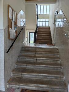 a staircase in a building with a stair case at OASIS APARTMAN II. in Szeged