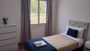 En eller flere senge i et værelse på Cordon del Velazco