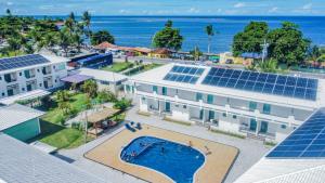 an aerial view of a building with solar panels on it at Areia do Atlantico Hotel in Porto Seguro