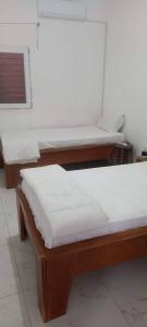 Voodi või voodid majutusasutuse Cocoon à Ziguinchor toas