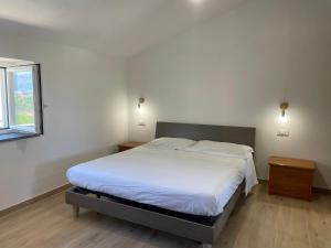 Postel nebo postele na pokoji v ubytování La Petit Maison