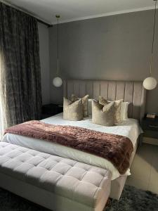 Кровать или кровати в номере 387 Ligusha Lane, Tubungu Estate
