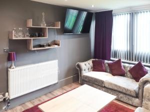 a living room with a couch and a window at The Inn And Around in Kenton