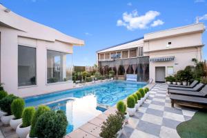 an image of a house with a swimming pool at PRIME LAND in Varanasi