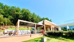 A garden outside Villa Olympia Pool Sea View Mountains Lake Nature Sleeps 8 Air Conditioning Wi-Fi