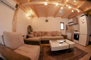 a living room with a couch and a table at Koji Vajat in Rudnik