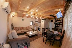 a living room with a couch and a table at Koji Vajat in Rudnik