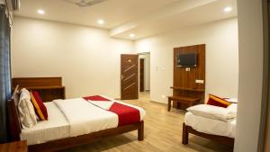 Postel nebo postele na pokoji v ubytování Hotel Sun Suites - A unit of SUN Group - Spacious Rooms - Brand New Building