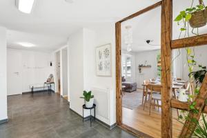 a living room with a mirror and a dining room at Klara 1022 - Olma, Spital, Uni St- Gallen in St. Gallen +13 photos